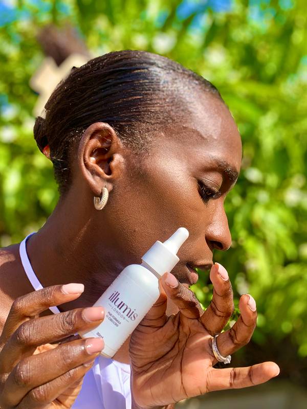 Woman using Vital Roots dropper
