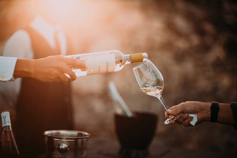 Pouring white wine into a glass