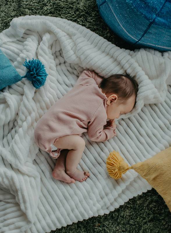 Baby sleeping peacefully in organic sleepwear